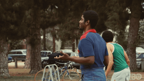 A man turns around and looks at the camera saying, 'Let's discuss this.'